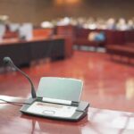 Conference microphone on a desk in a courtroom