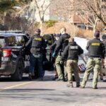 Navy Chief Snared In Child Sting Police and sheriff officers gather around vehicles on a suburban street