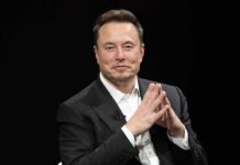 Musk Donates $150 Million to Senate Group Elon Musk seated in a black suit with hands clasped