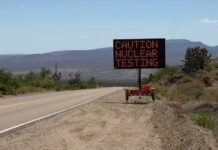 Trump REVIVES Forgotten Nuclear Testing Program Electronic roadside sign warning of nuclear testing in desert