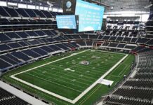 Jason Kelces Live-Mic Slip Stuns NFL Booth American football stadium interior with large central video board